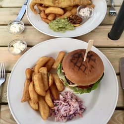 The Fox - Halloumi & portobello mushroom burger £12 (front) and cod & chips £13.50.