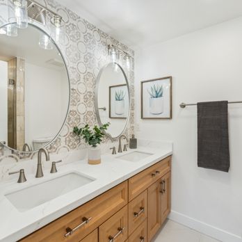 WM Construction - Full master bathroom remodel with beautiful tiled backsplash accent wall, dual sink natural wood vanity, and brushed nickel hardware - General Contractors Near Me WM Construction - Full master bathroom remodel with beautiful tiled backsplash accent wall, dual sink natural wood vanity, and brushed nickel hardware - General Contractors Near Me