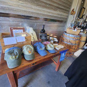 Ecluse Wines - a selection of hats on a table - Wineries Near Me - Paso Robles, California
