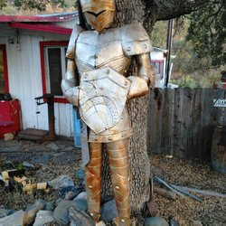 Dials Rock & Fossil Shop - A welcoming armored man.