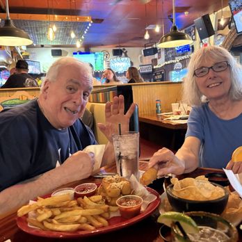 Sagebrush Cantina - Happy Family sharing delicious mozzarella sticks & fries, queso,salsa chips,margaritas & well drinks - Mexican Near Me - Fenton, Michigan Sagebrush Cantina - Happy Family sharing delicious mozzarella sticks & fries, queso,salsa chips,margaritas & well drinks - Mexican Near Me - Fenton, Michigan