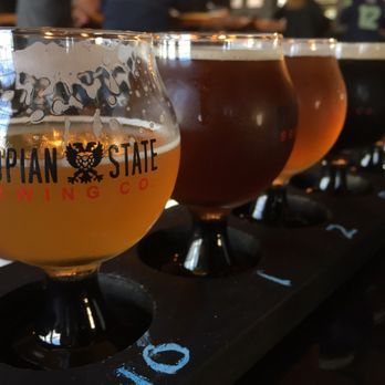 Dystopian State Brewing Company - Beautiful flight :) love that black stems of the glasses - Breweries Near Me - Tacoma, Washington