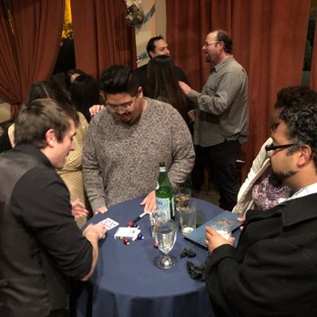 Apollo Magic - Bryan of Apollo Magic performing at our holiday party! - Magicians Near Me