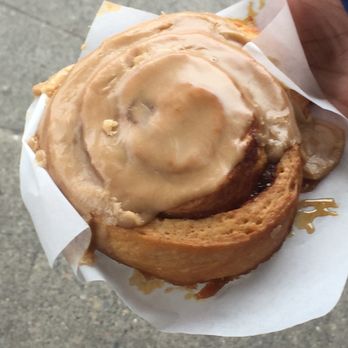 Cinnamon Works - Vegan cinnamon bun w/ frosting - Bakeries Near Me - Seattle, Washington Cinnamon Works - Vegan cinnamon bun w/ frosting - Bakeries Near Me - Seattle, Washington