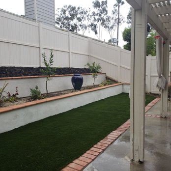 Crux Landscape, Inc. - Terraced planters a large d artificial turf. - Landscaping Near Me
