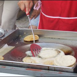 Gorditas Aracey - Tortillas are cooked in oil, in a wok.  Note the puffed tortilla that has been removed from the oil.