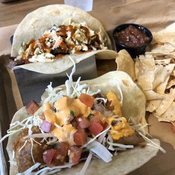Mojo's Tacos - Franklin - fish taco up close and brisket taco in the back - Tacos Near Me - Franklin, Tennessee Mojo's Tacos - Franklin - fish taco up close and brisket taco in the back - Tacos Near Me - Franklin, Tennessee