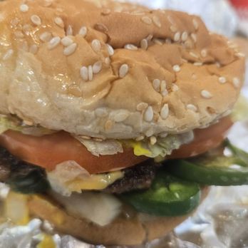 Five Guys - Single with Mustard, grilled onion, grilled jalapeño, lettuce, tomato, pickle, and cheese. - Burgers Near Me - Fort Smith, Arkansas