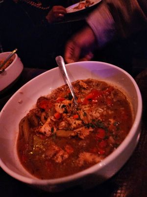 Photo of The Jazz Kitchen - Indianapolis, IN, US. a bowl of soup with a spoon in it