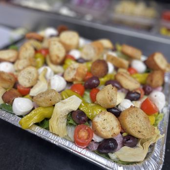 Sick Pizza - a tray of food on a table - Pizza Near Me - Oxford Charter Township, Michigan Sick Pizza - a tray of food on a table - Pizza Near Me - Oxford Charter Township, Michigan