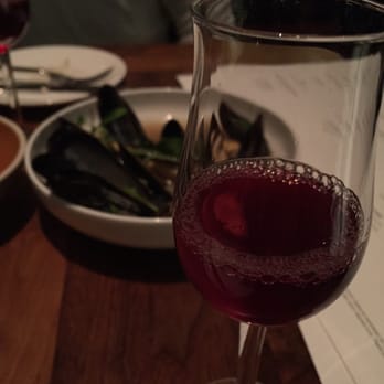 Redbird - Mussels in the background. Complimentary drink: vermouth and some berry juice. I couldn't hear the waitress over the noise. - New American Near Me - Los Angeles, California