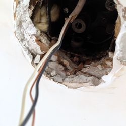Wright Brothers Electric Company - Wiring was updated but the box holding a ceiling fan was left with only one screw holding it.  Also, the box didn't contain the wiring.