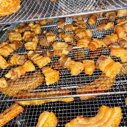 Porky Wow! - No ugly deep frying here, we bake our soft and crunchy chicharrones. Enjoy, Order Now!