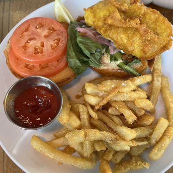 Snug Harbor - Fish Sandwich with side of fries - American Near Me - Grand Haven, Michigan