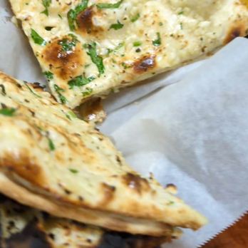 Punjab Cafe - Garlic naan and Chicken Coconut in the background - Indian Near Me - San Jose, California Punjab Cafe - Garlic naan and Chicken Coconut in the background - Indian Near Me - San Jose, California