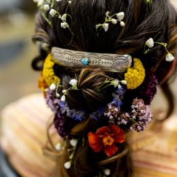 Aura Hair Salon - Wedding updo with flowers and silver hair barette with turquoise