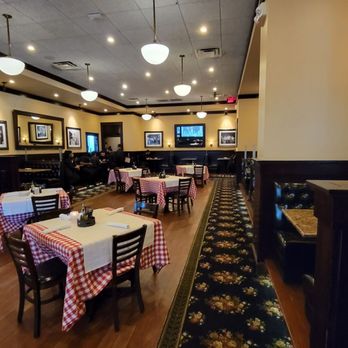 Maggiano's - One of 3 dining rooms. This one is next to the kitchen. The kitchen door is on the left. It has a round window. - Italian Near Me - Springfield, Virginia Maggiano's - One of 3 dining rooms. This one is next to the kitchen. The kitchen door is on the left. It has a round window. - Italian Near Me - Springfield, Virginia