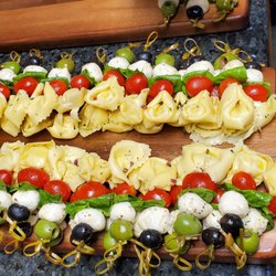 Chef Gregory's Gourmet Catering - Appetizers combination of homemade tortellini with marinated mozzarella, tomatoes and olives