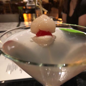 Snow Pea Asian Bistro - a woman in the background - Sushi Bars Near Me - Austin, Texas
