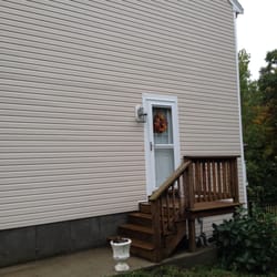 Casey Power Wash - Wooden steps and vinyl after washing