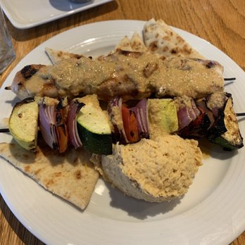 Irregardless Cafe - Chicken kabob with lemon tahini sauce, veggies, and hummus - super tasty! - New American Near Me - Raleigh, North Carolina