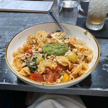 The Ice Plant - Pesto pasta with tomatoes, artichoke, etc - Cocktail Bars Near Me - St. Augustine, Florida