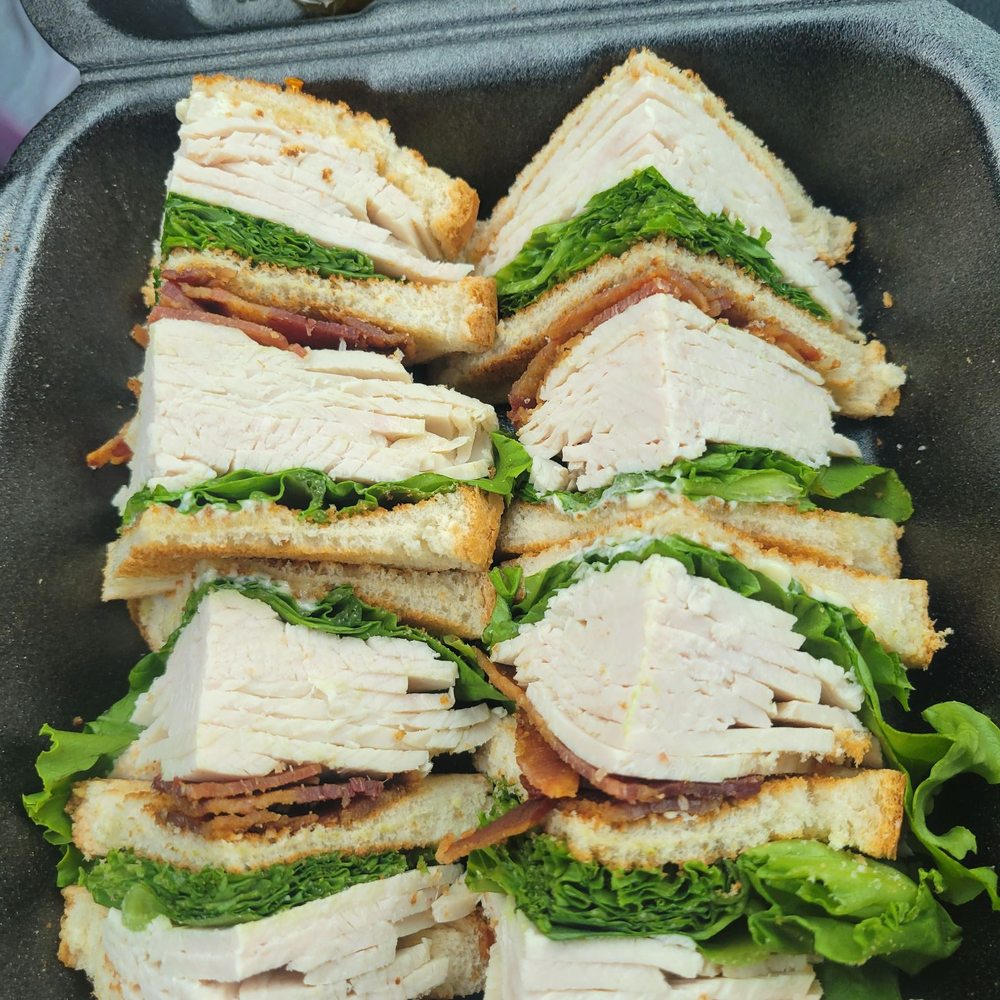Club sandwich to go minus tomato Club sandwich to go minus tomato