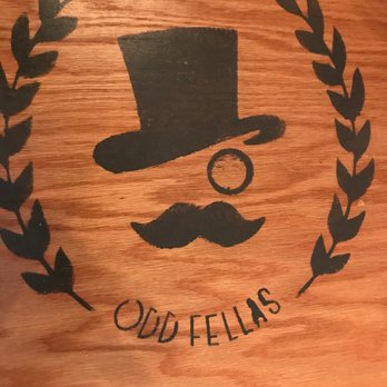 Odd Fellas - a top hat and mustache on a wooden table - Burgers Near Me - Lock Haven, Pennsylvania