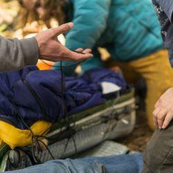 With The Wild Things - Practicing improvising a leg splint during a With The Wild Things Wilderness First Aid Class scenario