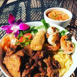 Deejai Thai - Grilled pork with noodles, lettuce, herbs, shrimp and spring roll.