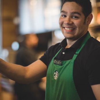 Starbucks - a smiling bari in a green apron - Coffee & Tea Near Me - Oakville, Ontario Starbucks - a smiling bari in a green apron - Coffee & Tea Near Me - Oakville, Ontario