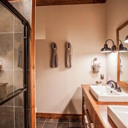 Away From It All Lodge - Each bath has dual vanities and oversized stone showers.  Luxury!