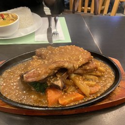 Sizzling plate pork chop with garlic sauce Sizzling plate pork chop with garlic sauce