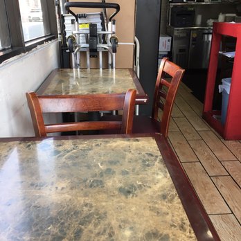 Moti Mahal - a table and chairs in a restaurant - Indian Near Me - Seattle, Washington Moti Mahal - a table and chairs in a restaurant - Indian Near Me - Seattle, Washington