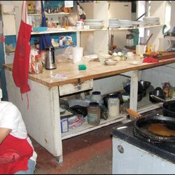 Puerto Viejo - The two gentlemen in the kitchen were hard at work when I stuck my head through the door and snapped this photo of the kitchen staff at work