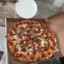 Dough Boys NY Style Pizzeria - Large 20 in Supreme pizza (no black olives) next to a dinner plate for scale!