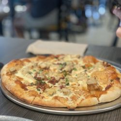 Mangini’s Pizzeria - Spicy BBQ chicken pizza! Has a good kick and so flavorful but not too spicy!