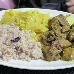 Akhibachis halal food - Curry goat, cabbage and rice and beans. Amazing!!