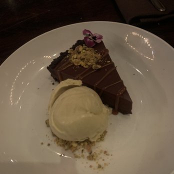 Under the Cork Tree - Dark Chocolate Tart with Pistachio Ice Cream - New American Near Me - Sandy Springs, Georgia Under the Cork Tree - Dark Chocolate Tart with Pistachio Ice Cream - New American Near Me - Sandy Springs, Georgia