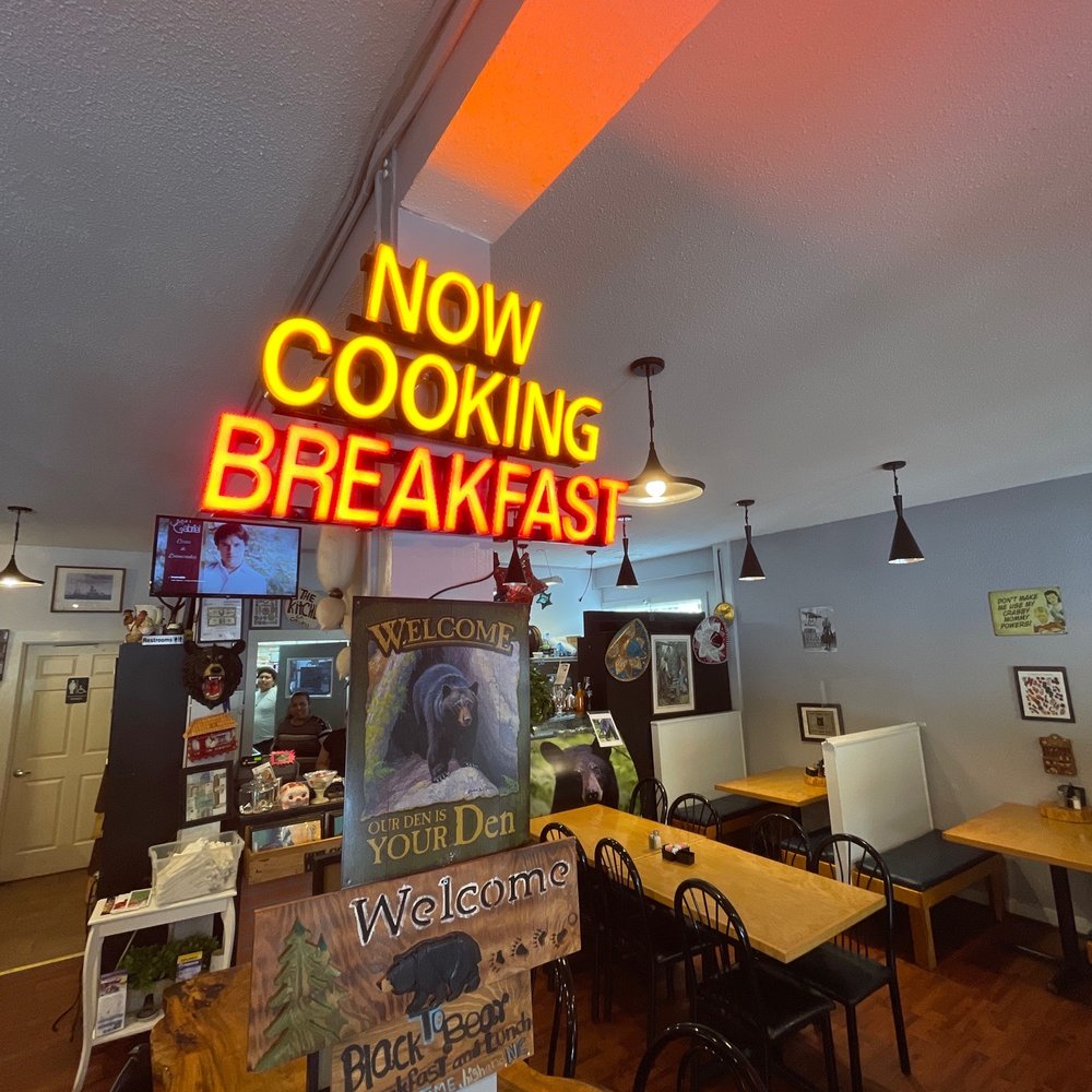 Black Bear - a restaurant with a neon sign that says now cooking breakfast - Breakfast & Brunch Near Me - Highlands, North Carolina
