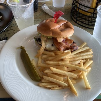 Jimmy Buffets Margaritaville Restaurant - Guacamole Bacon Burger with Fries - New American Near Me - St. Thomas, Virgin Islands Jimmy Buffets Margaritaville Restaurant - Guacamole Bacon Burger with Fries - New American Near Me - St. Thomas, Virgin Islands