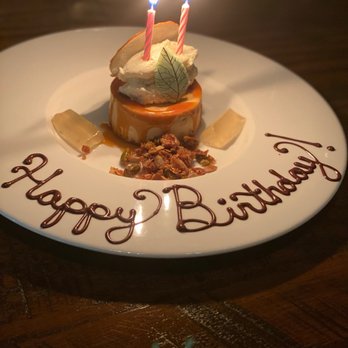 The Baltimore Chophouse - a birthday cake with candles - Barbeque Near Me - Baltimore, Maryland The Baltimore Chophouse - a birthday cake with candles - Barbeque Near Me - Baltimore, Maryland