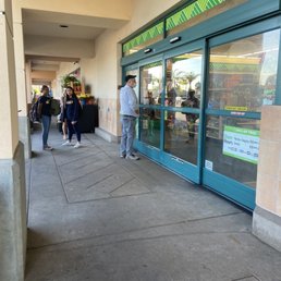 Exterior outside entrance of Dollar Tree - There is always that guy who rudely taps on the window with his keys before the store opens - Long Beach, California Exterior outside entrance of Dollar Tree - There is always that guy who rudely taps on the window with his keys before the store opens - Long Beach, California