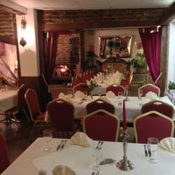Restaurant Wolff-Farm - Main eating area. Authentic German decoration and a beautiful real and cozy fireplace.