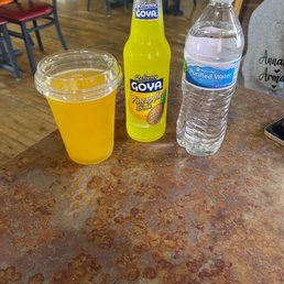 Passion fruit, pineapple soda and bottled water