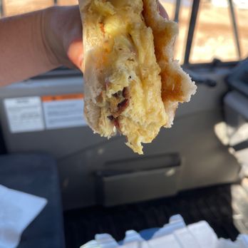 Rooster Run Cafe - Half eaten breakfast sandwich with xtra crispy bacon & pepper-jack cheese - Steakhouses Near Me - Hurricane, Utah Rooster Run Cafe - Half eaten breakfast sandwich with xtra crispy bacon & pepper-jack cheese - Steakhouses Near Me - Hurricane, Utah