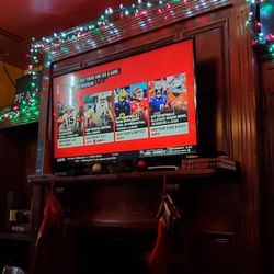 O'Connor's Public House - Sitting at high top table and chair watching sport channel, Friday 12/29/2023
