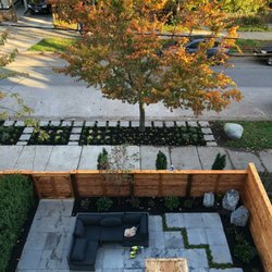 RainCoast Land Escapes - Granite paving custom fence and manhole cover