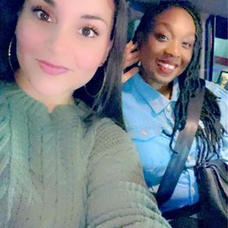 two women in a car taking a selfie two women in a car taking a selfie
