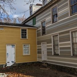 Connor Fort General Contractor - New Hardie siding and zip wall sheathing for a timber framed building.